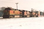 Stack train rolls west through University